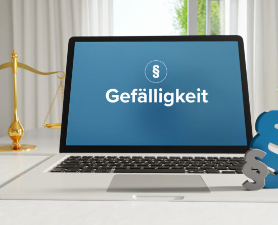 Laptop screen shows the German word 'Gefälligkeit' on a blue background, with a gold balance scale to the left and a large blue ampersand on the right.