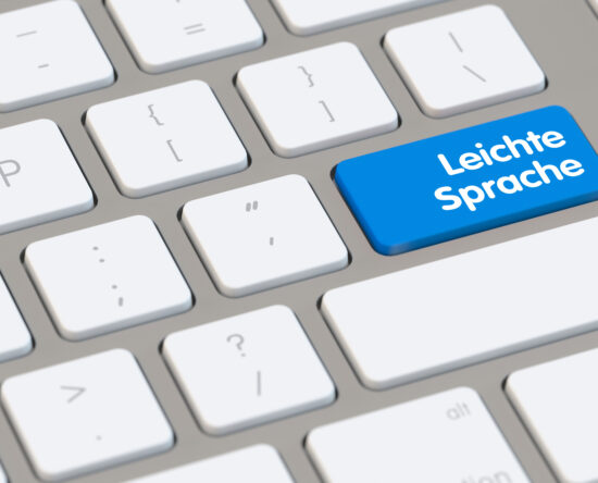 Blue key on a keyboard labeled 'Leichte Sprache' (Easy German) among white keys